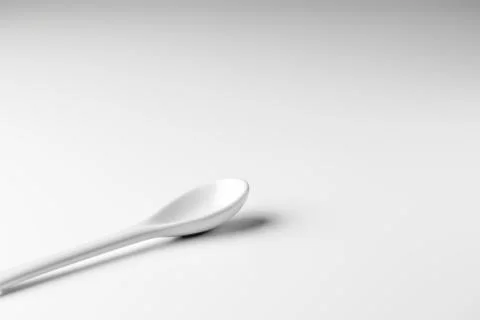 White spoon isolated on a white surface Stock Photos