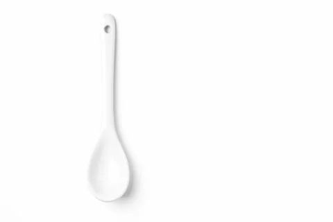 White spoon isolated on a white surface Stock Photos