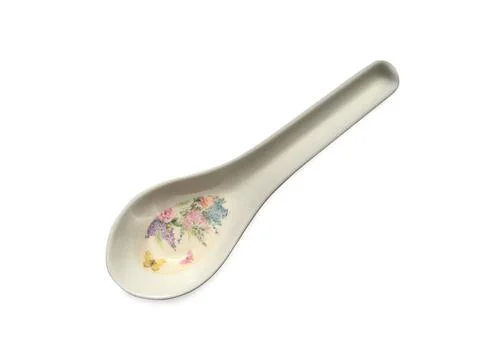 White spoon with a pattern of flowers on white background. Clipping path Stock Photos