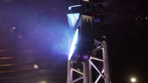 White spot lighting that projects a beam of light onto smoke that loops Video stock 248159827