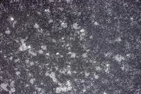 White spots on a black background. Texture. Stock Photos