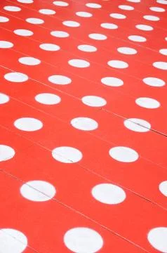 White spots on red floor for background. Stock Photos