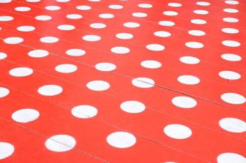 White spots on red floor for background. Stock Photos