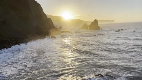 White spray mist foam from ocean water colliding with cliffs Stock Footage 242601761