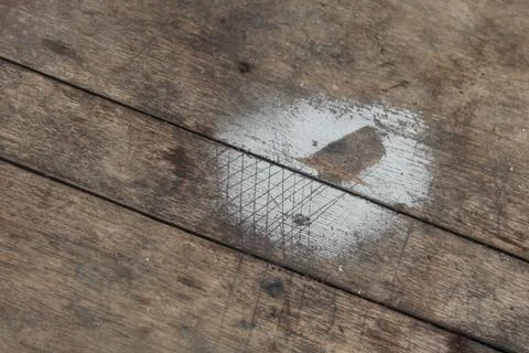 White Spray Paint Marks on Rustic Wooden Workshop Floor Stock Photos