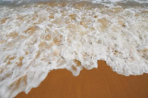White spum on beach Foto stock