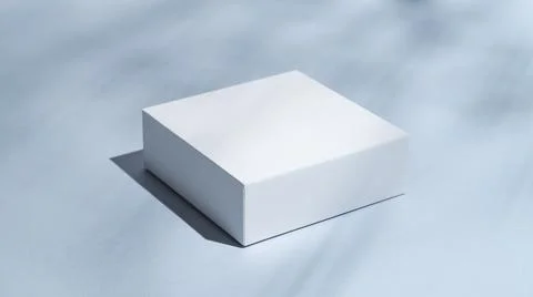 White square boxes on a blue background with shadows close up. Stockfoto's