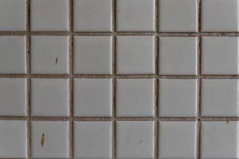 White square ceramic tiles forming grid pattern 写真素材