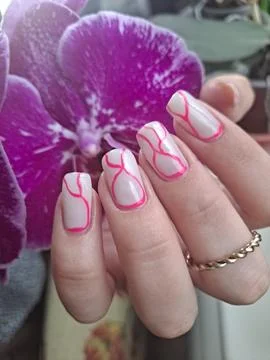 White Square Nails with Abstract Pink Lines Near Purple Orchid Stock Photos