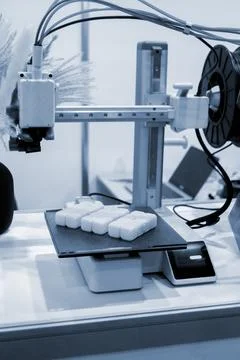 A white square object build surface 3D printer close up. A white plastic model Stock Photos