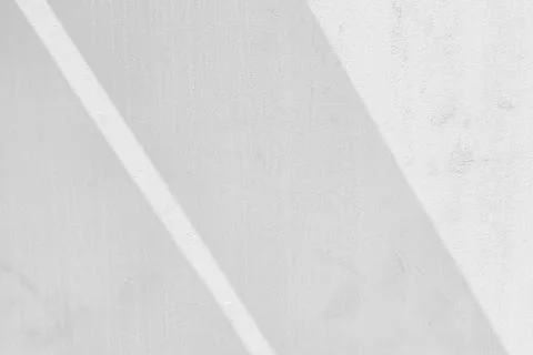 White Stained Concrete Wall with Light Beam and Shadow on the Surface. Illustrazione stock