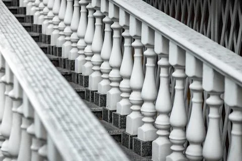 White staircase with balusters. Repetitive elements in architecture. Marble s Stock Photos