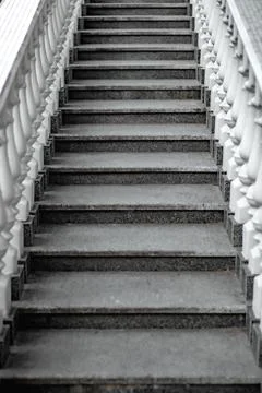 White staircase with balusters. Repetitive elements in architecture. Marble s Stock Photos