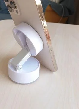White stand with suction cup and magnet for smartphone. Technology and equipment Stock Photos