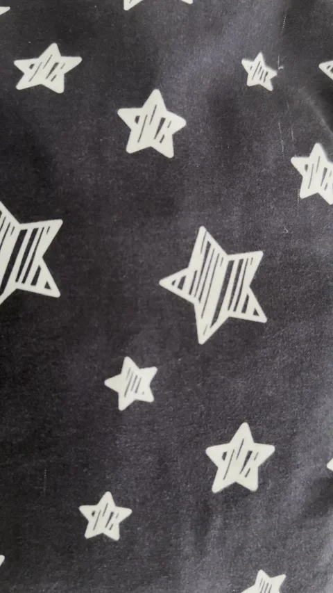 White Star Pattern on Black Fabric Stock Footage 346076433