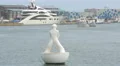 White statue floating on water in port in Barcelona 4k or 4k+ Resolution