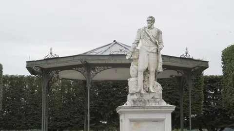 White statue front of a kiosk, Cauterets, France Stock Footage 103703375