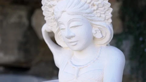 White statue of Indian deity in garden Stock Footage 272748196