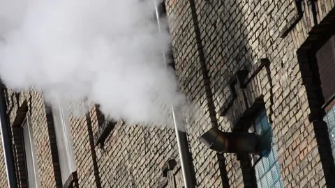 White Steam going from vent on an old brick wall Stock-Footage 138750878