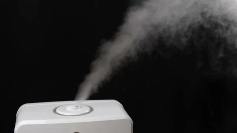 White steam of humidifier on dark background. Diffused mist from inhaler Video stock 147207464