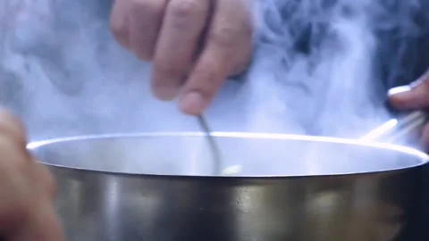 White Steam Rises from the hot Pan. Cooking in the pan in the kitchen Stock Footage 150590697