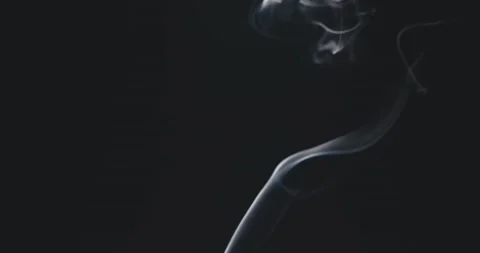  White steam rises light, graceful twists on a black background.  Stock Footage 220387166