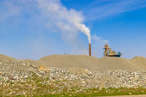 White steam rising up from pipe of small asphalt factory at day time with p.. Stock Photos