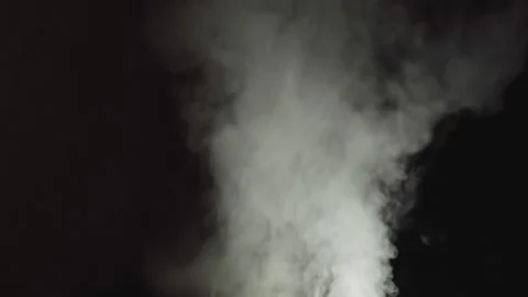 White steam from water on a black background directed upwards Stock Footage 148257549
