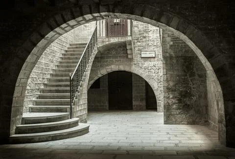White stone archway with multiple steps leading up to the entrance Stock Photos