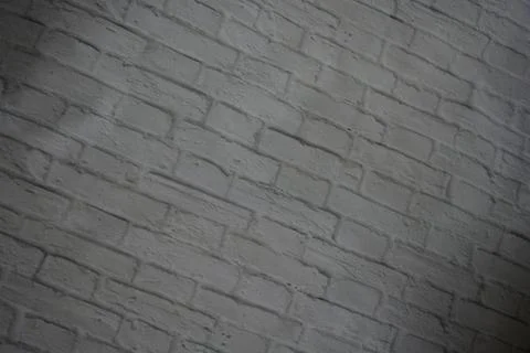 White stone background of light bricks covered with layer of white paint texture Stockfoto's