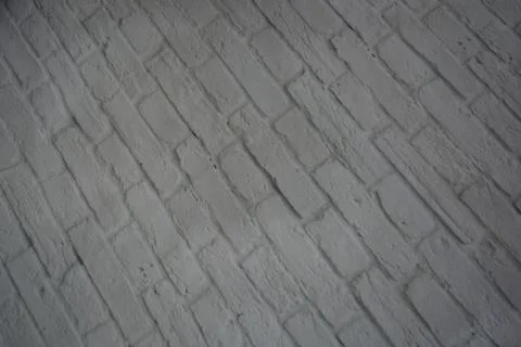 White stone background of light bricks covered with layer of white paint texture 스톡 사진