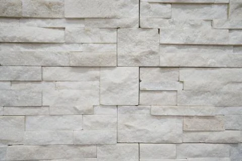 White stone bricks texture, exterior rough geometric pattern Stock Photos