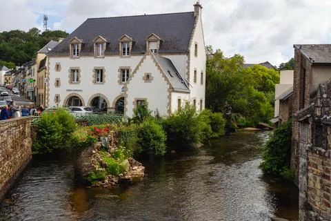 White stone building by the flowing river. Pont-Aven, 09 June 2026 Stock Photos