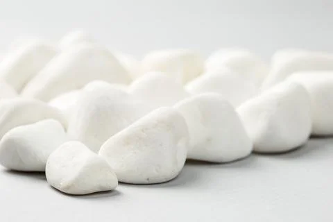 White stone on the grey background border Stock Photos