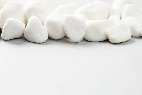 White stone on the grey background border Stock Photos