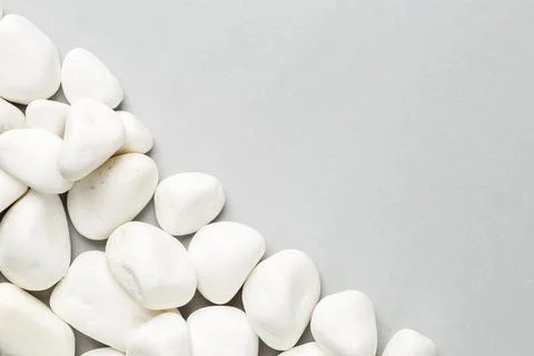 White stone on the grey background border Stock Photos