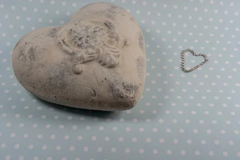 White stone heart in shabby chic style and sparkling crystal chain heart on w Stock Photos