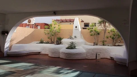 White, stone seating in courtyard Stock Footage 84789762