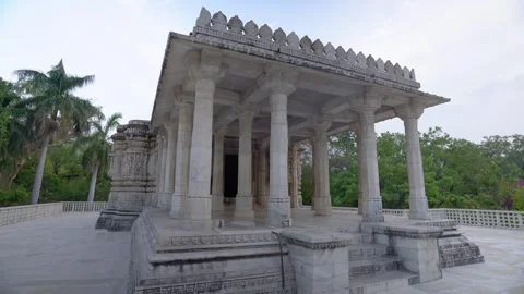 White Stone Temple Surrounded by Hills and Greenery Stock Footage 311798435