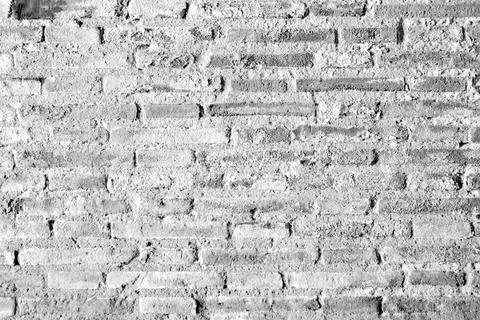 White stone wall with grain texture. Stock Photos