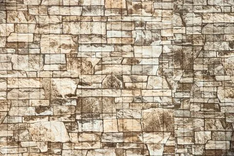 White stone wall with irregular masonry, texture, light stone background a Stock Photos