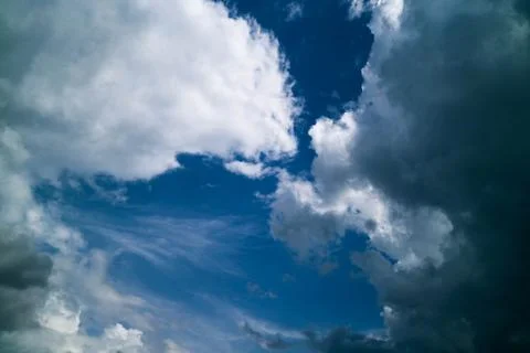 White storm clouds in the background at noon. Stock Photos