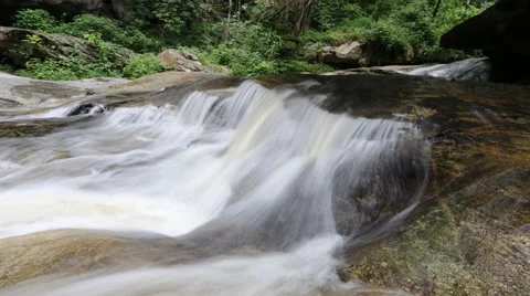 White streams flowing from the waterfall Stock Footage 68668798