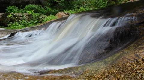 White streams flowing from the waterfall Stock Footage 68688934