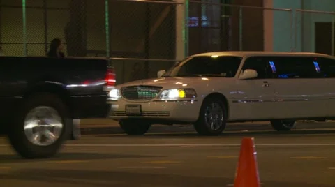 White Stretch Limo Leaving Event Stock Footage 21995100