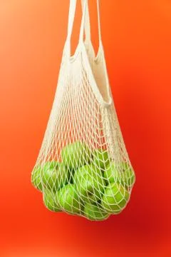 White string bag with green apples. Stock Photos