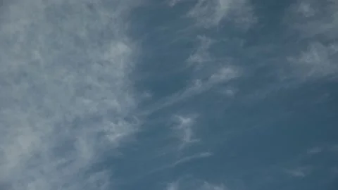 White stringy Cirrus clouds drift throug... | Stock Video | Pond5