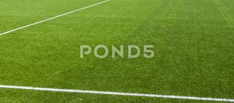 White stripe on the green soccer field Stock Photos