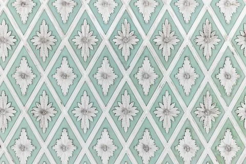 White stucco pattern over light green backdrop. Classic ceiling design Stock Photos