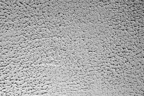 White Stucco Wall Texture Background with Rough Grainy Plaster Surface Patter Stock Photos